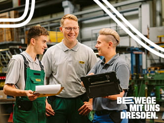 drei Mitarbeitende der DVB in der Werkstatt